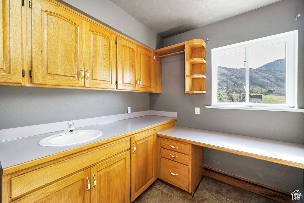 Interior space featuring a mountain view and a sink
