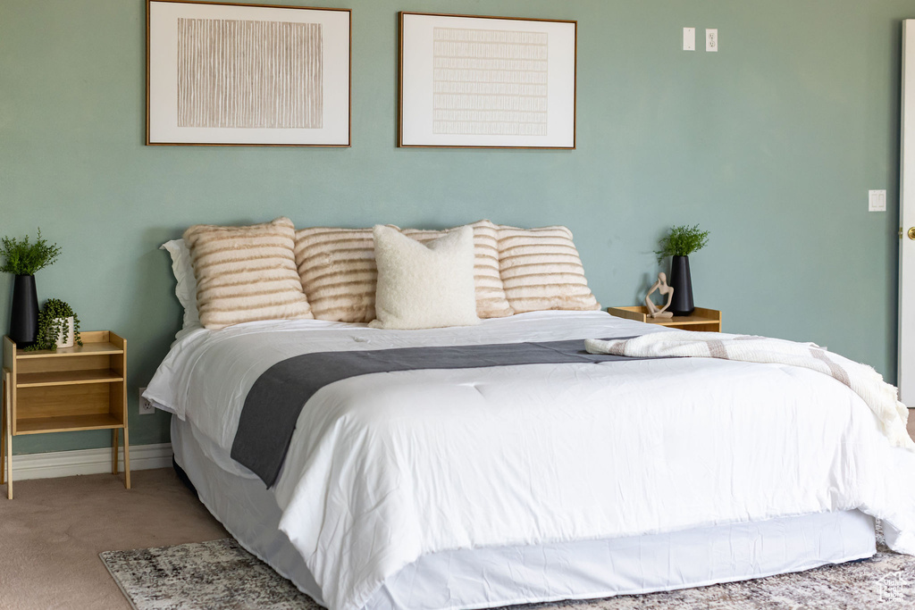 Carpeted bedroom with baseboards