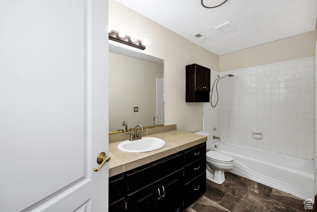 Full bathroom featuring visible vents, toilet, tub / shower combination, and vanity