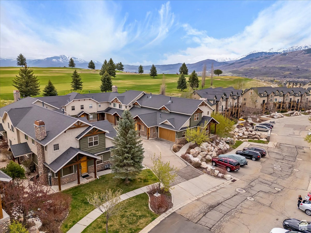 Birds eye view of property with a residential view and a mountain view