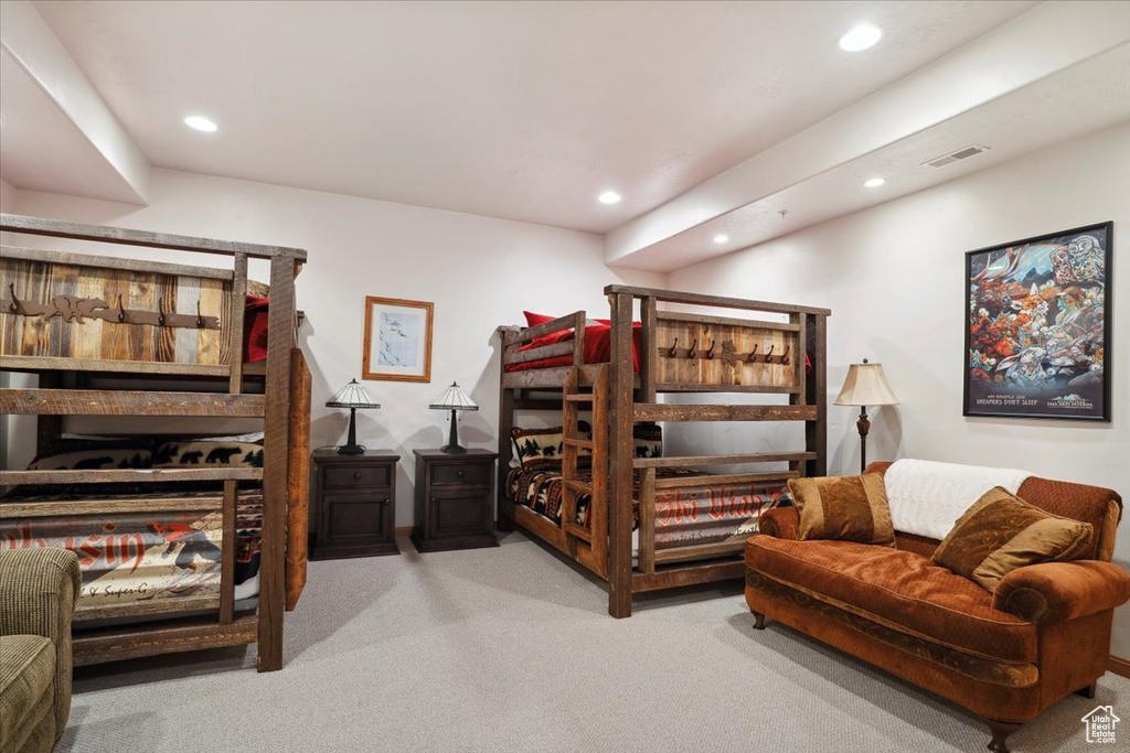 Carpeted bedroom featuring visible vents and recessed lighting