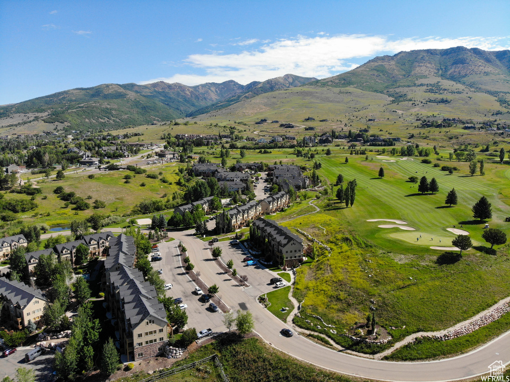 Bird's eye view with golf course view and a mountain view