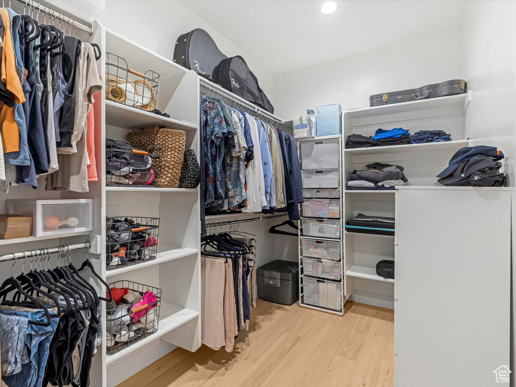 Spacious closet featuring wood finished floors