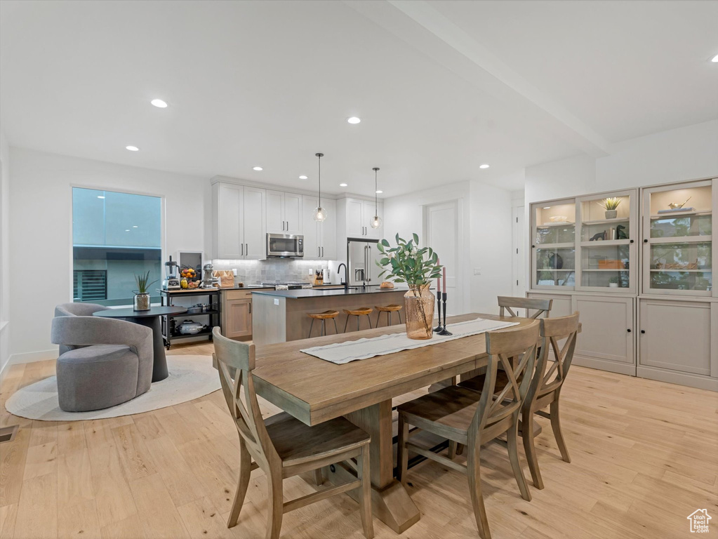 Dining space with recessed lighting, visible vents, and light wood-style flooring