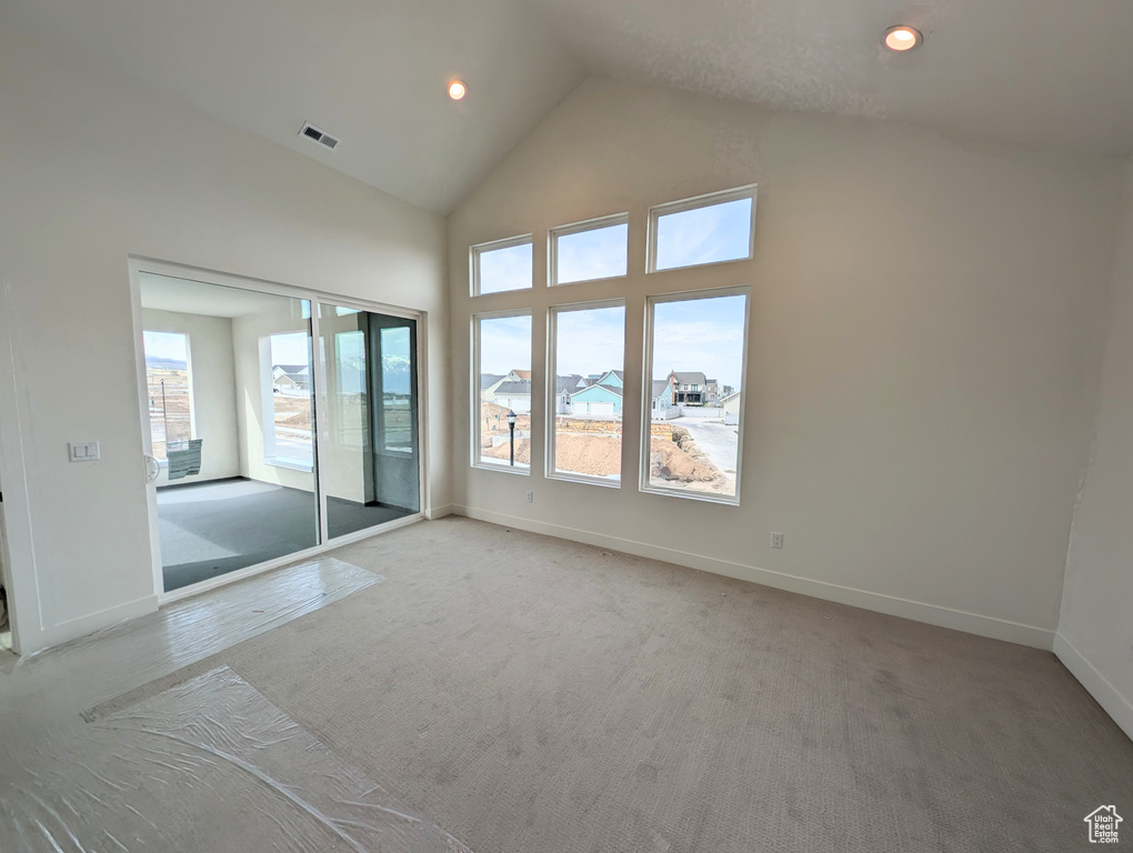 Unfurnished bedroom featuring visible vents, baseboards, recessed lighting, and multiple windows
