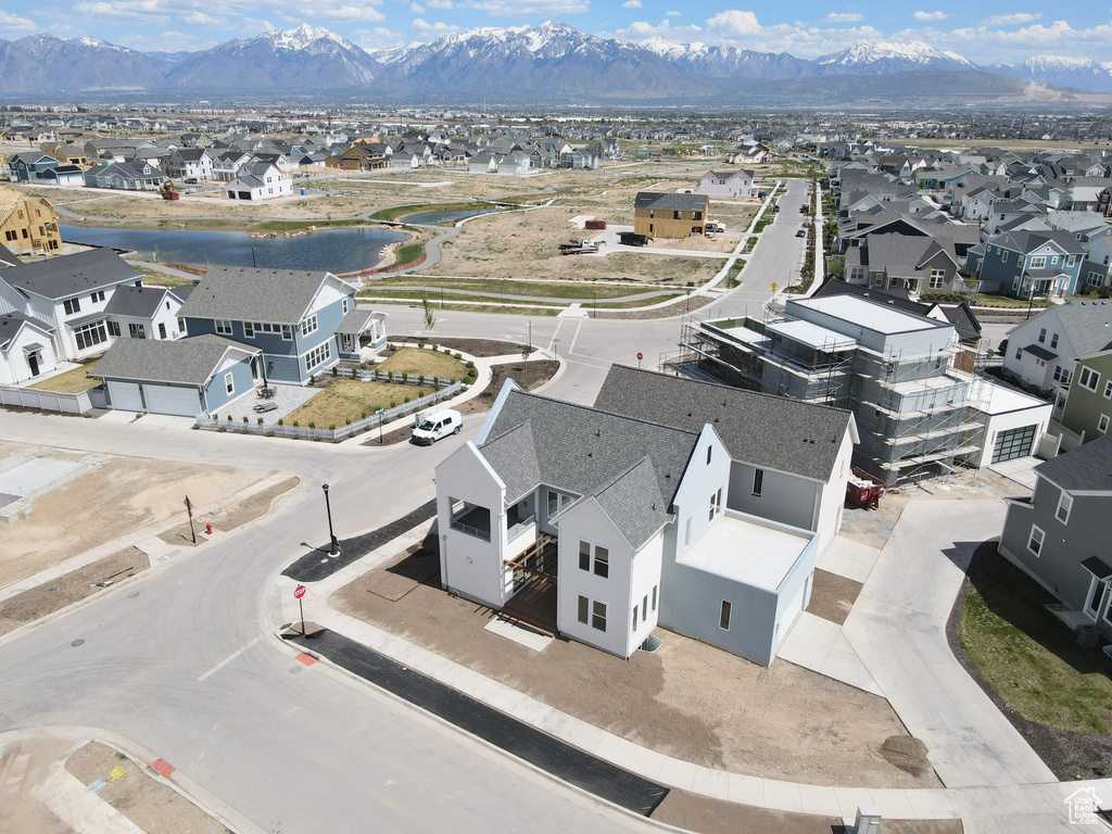 Birds eye view of property with a mountain view and a residential view
