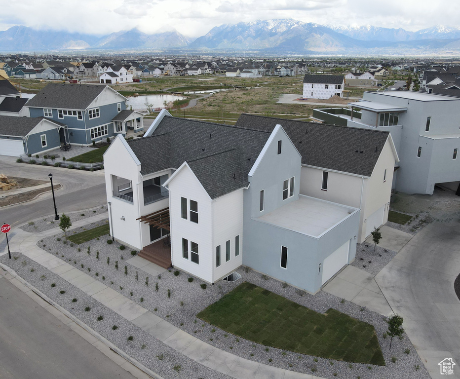 Aerial perspective of suburban area with a mountain backdrop