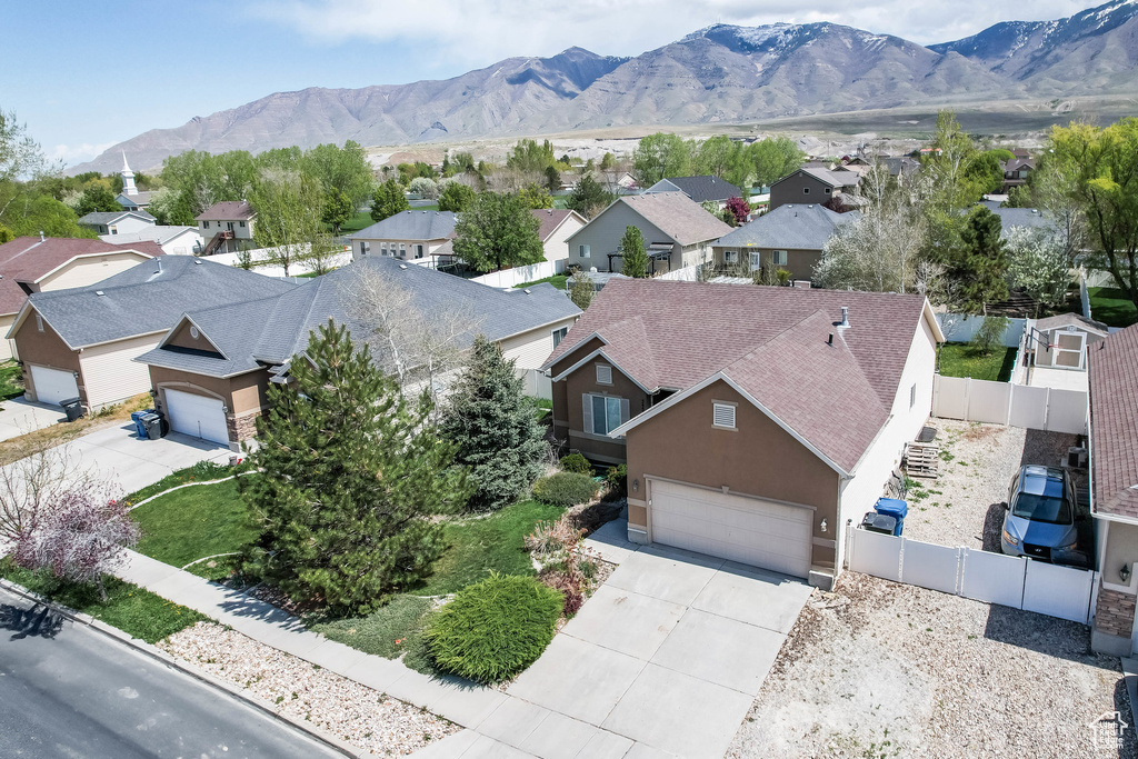 Aerial perspective of suburban area with a mountainous background