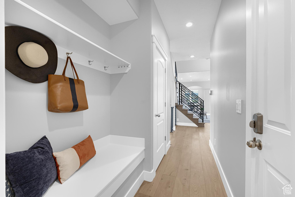 Mudroom with recessed lighting, light wood finished floors, and baseboards