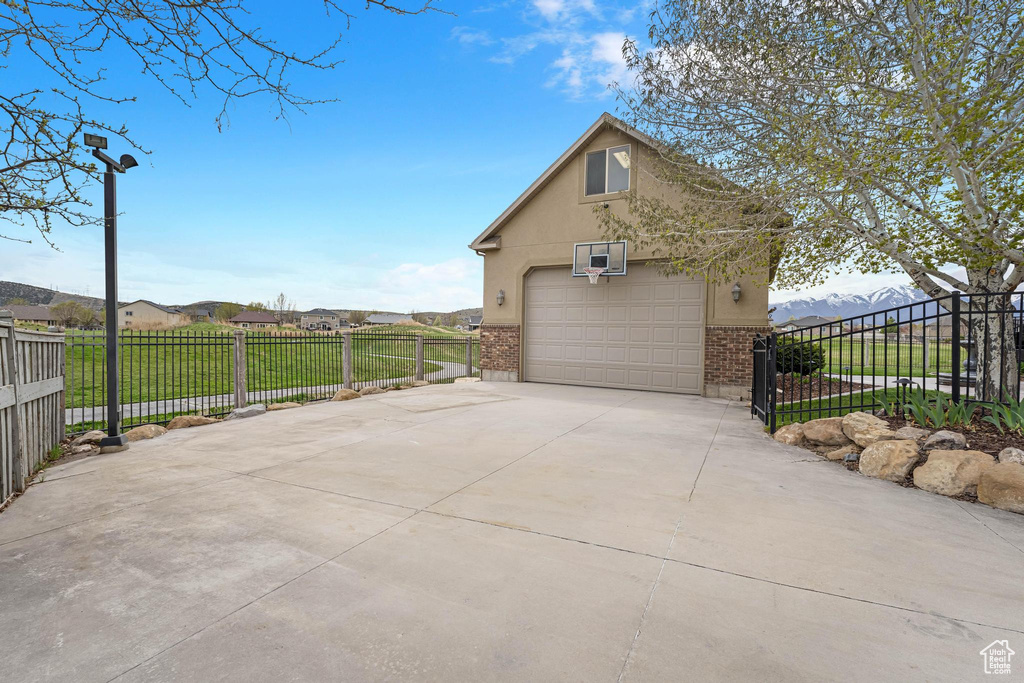 Garage with a detached garage and fence