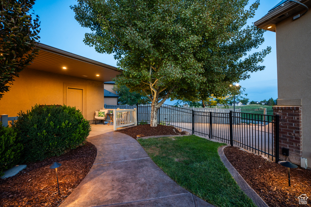 View of yard featuring fence