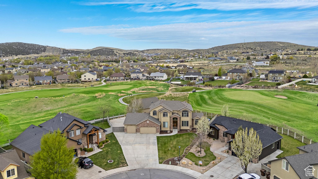 Drone / aerial view featuring a mountain view, a residential view, and view of golf course