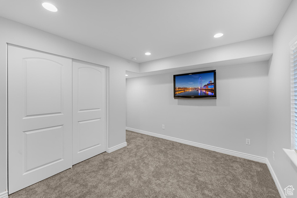 Below grade area with recessed lighting, baseboards, and carpet floors