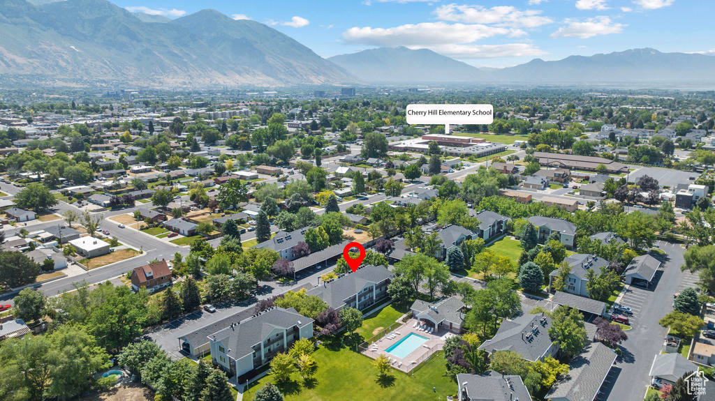 Bird's eye view of mountains and a pool area