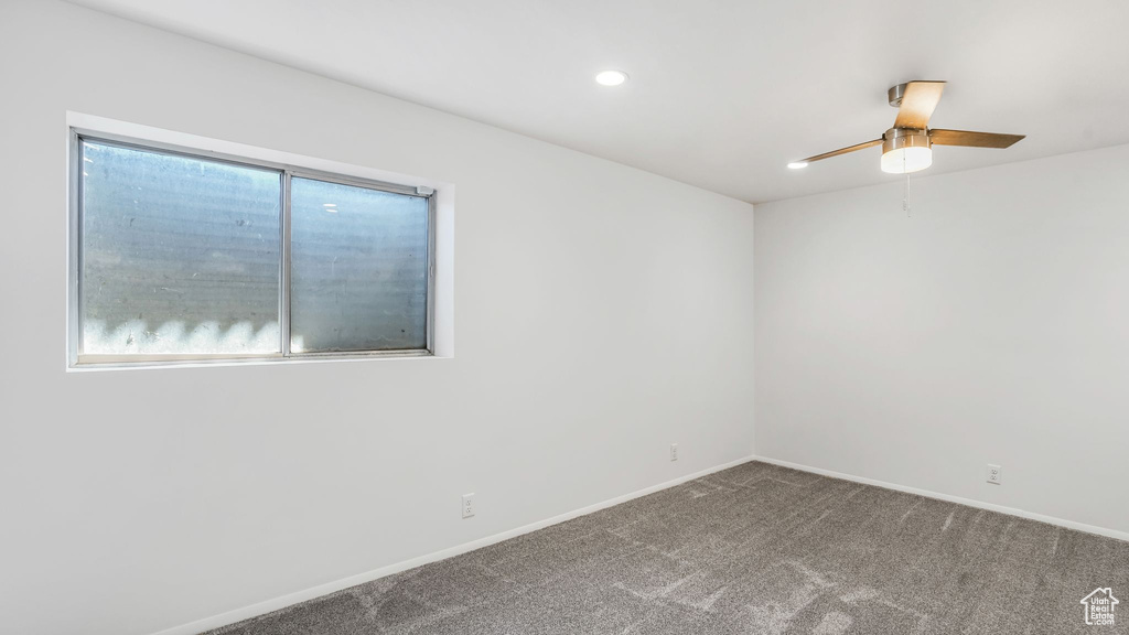 Carpeted spare room with baseboards, recessed lighting, and ceiling fan