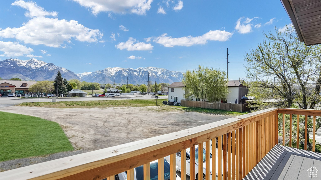 Wooden terrace featuring a mountain view