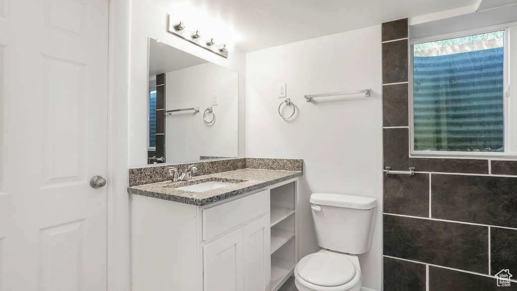 Bathroom with toilet and vanity
