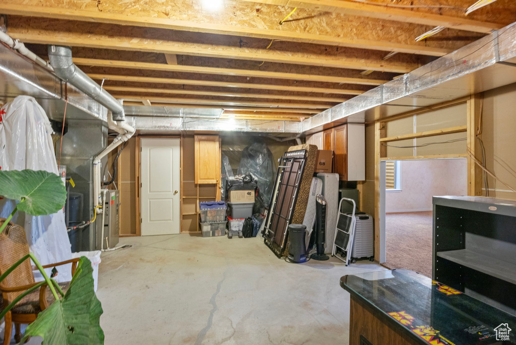 Unfinished below grade area with heating unit