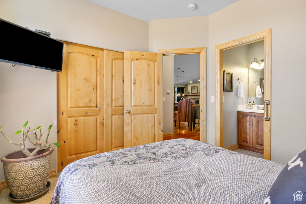 Carpeted bedroom with baseboards