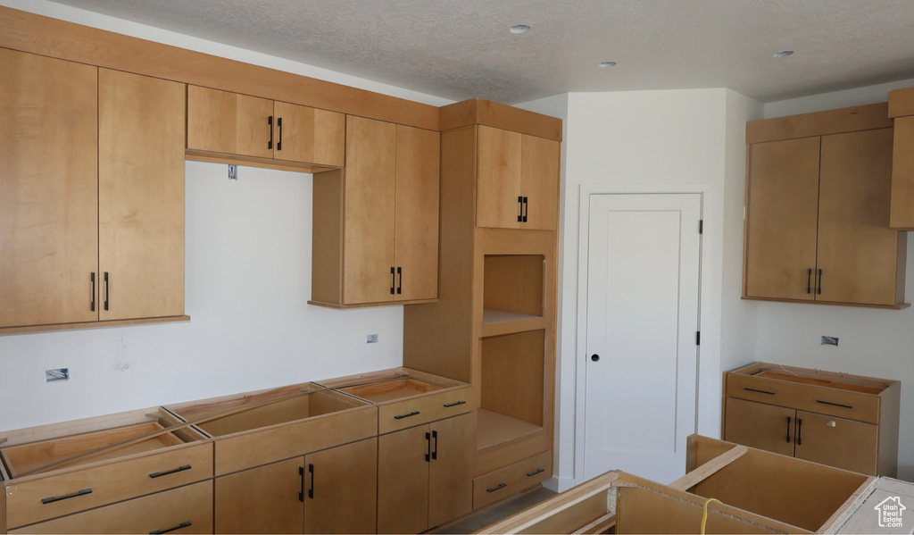 Kitchen with a textured ceiling