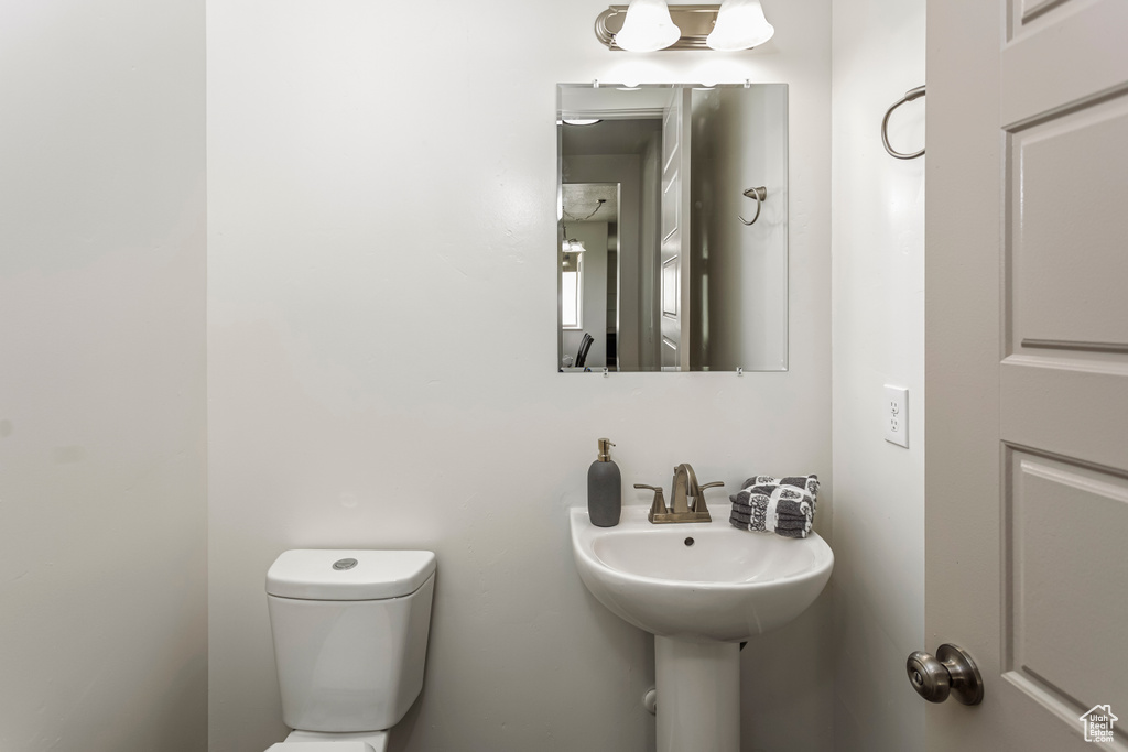 Half bath featuring toilet