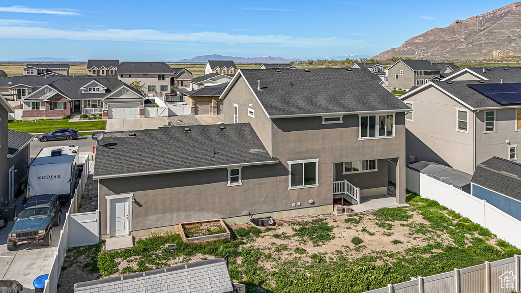 Drone / aerial view with a residential view and a mountain view