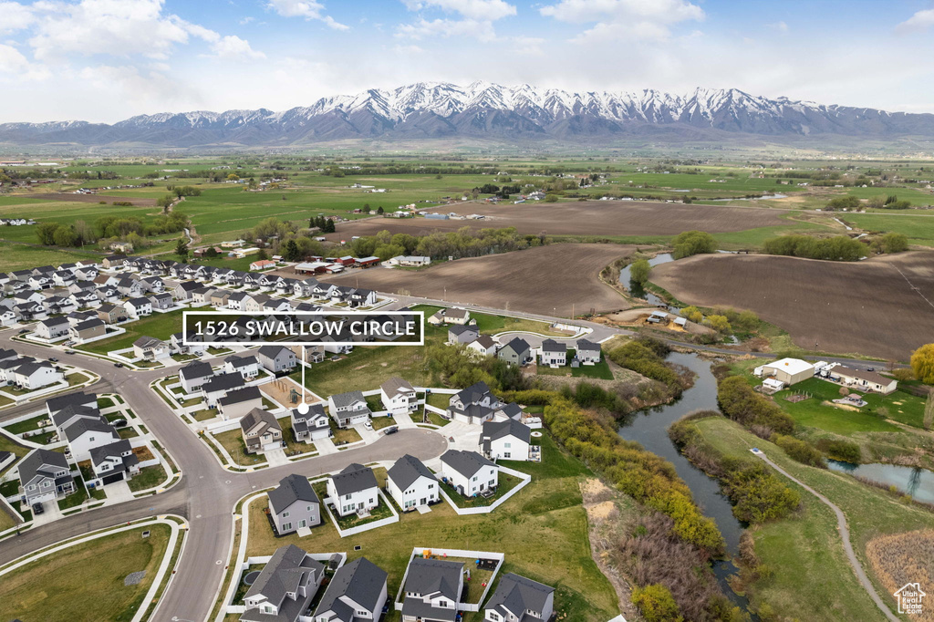 Aerial view featuring a residential view and a water and mountain view