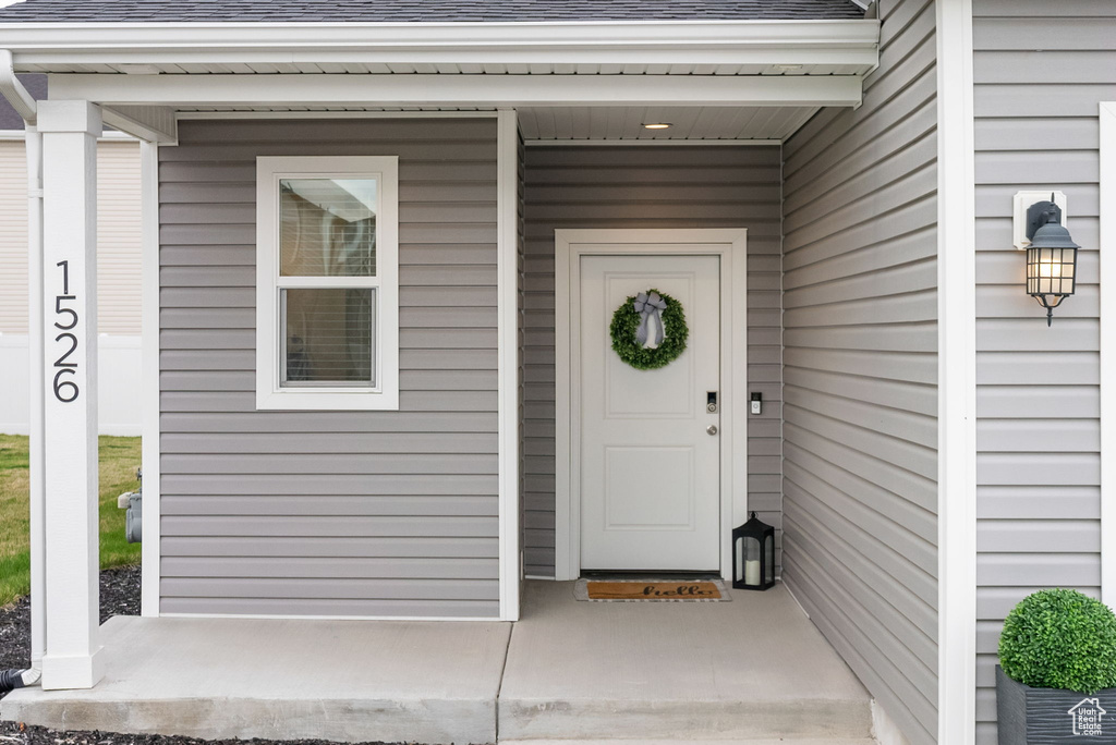 Property entrance with roof with shingles