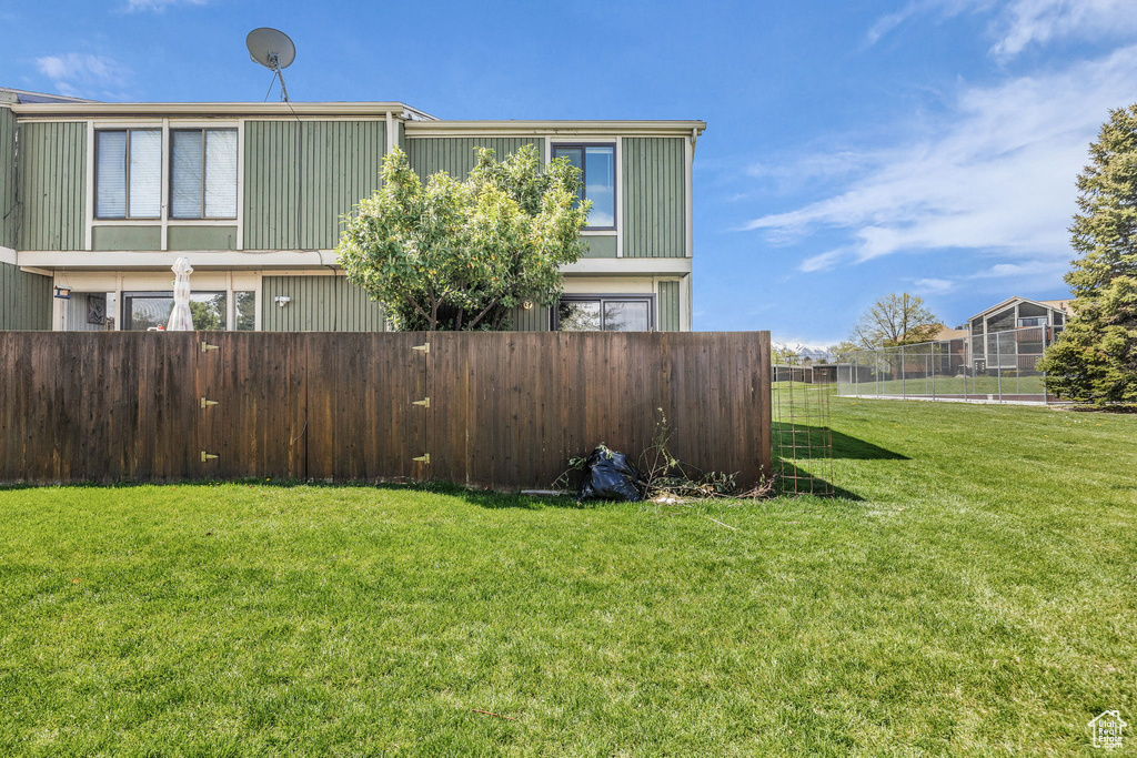 View of yard with fence