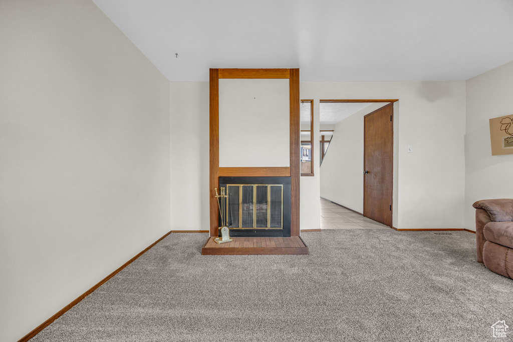 Living room with carpet flooring and baseboards