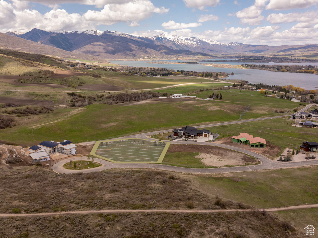 Drone / aerial view with a water and mountain view