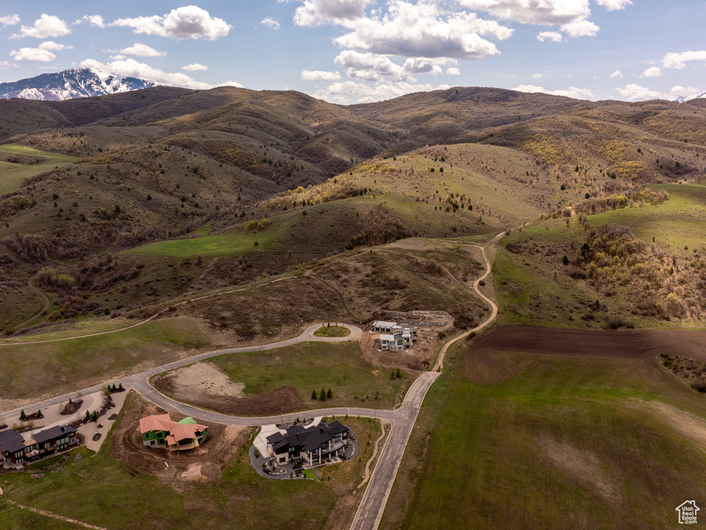 Birds eye view of property with a mountain view