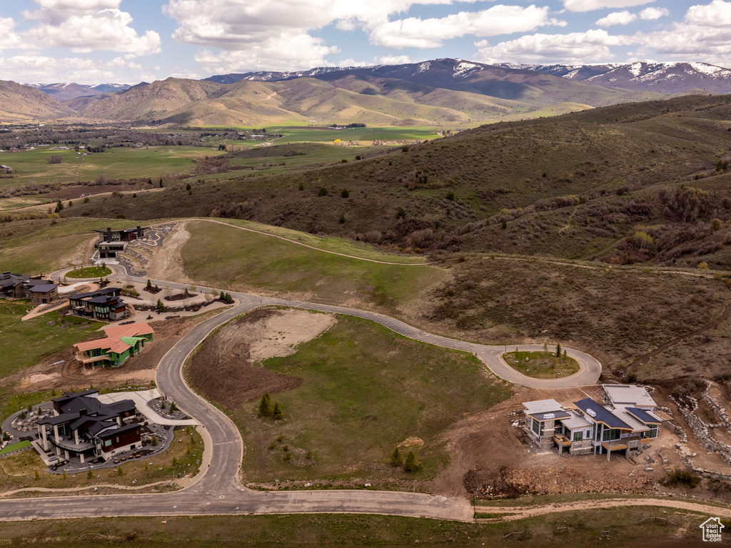Birds eye view of property with a mountain view