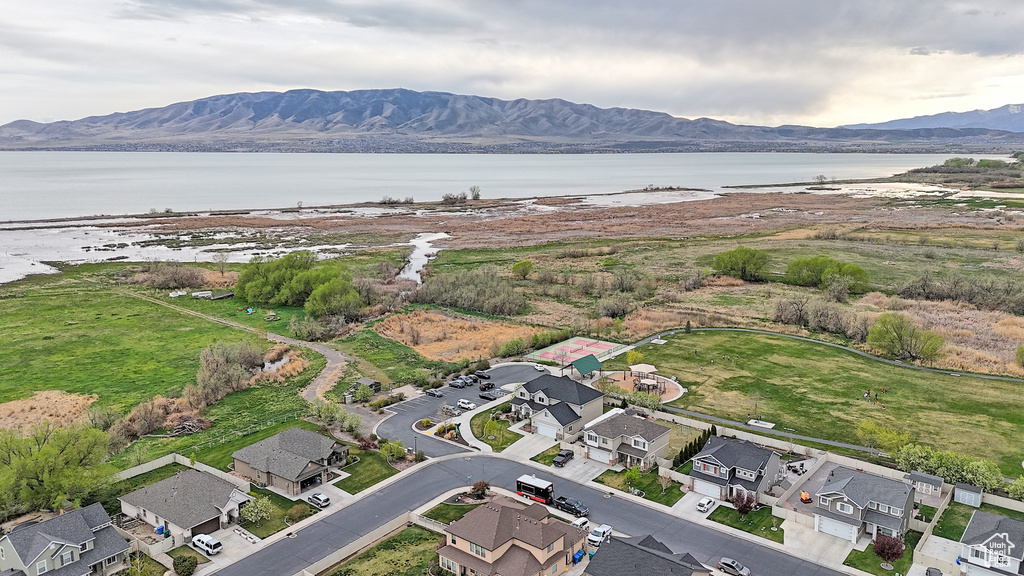 Drone / aerial view with a residential view and a water and mountain view