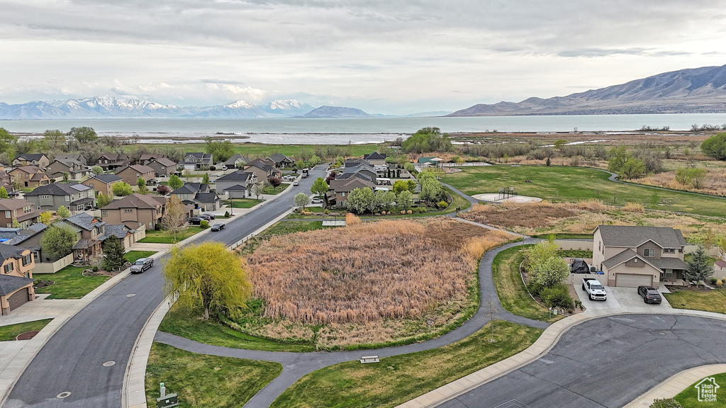 Aerial view featuring a residential view and a water and mountain view