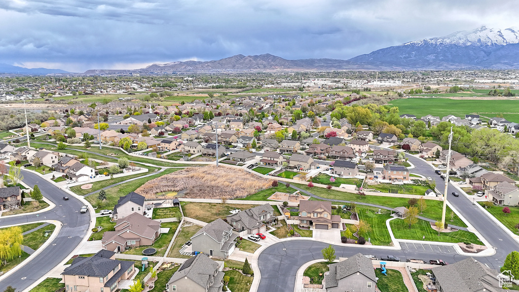 Birds eye view of property with a mountain view and a residential view
