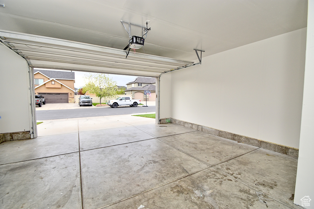 Garage featuring a garage door opener