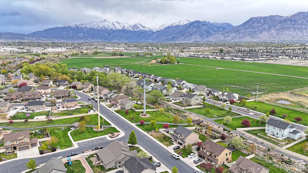 Birds eye view of property with a residential view and a mountain view