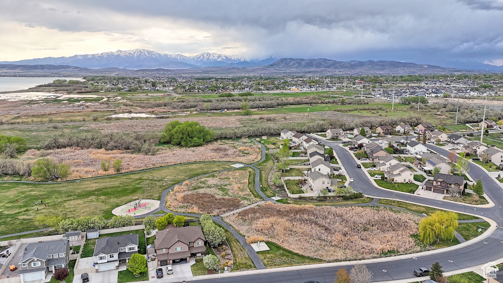 Birds eye view of property featuring a mountain view and a residential view