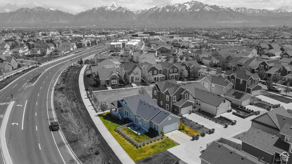 Birds eye view of property with a residential view and a mountain view