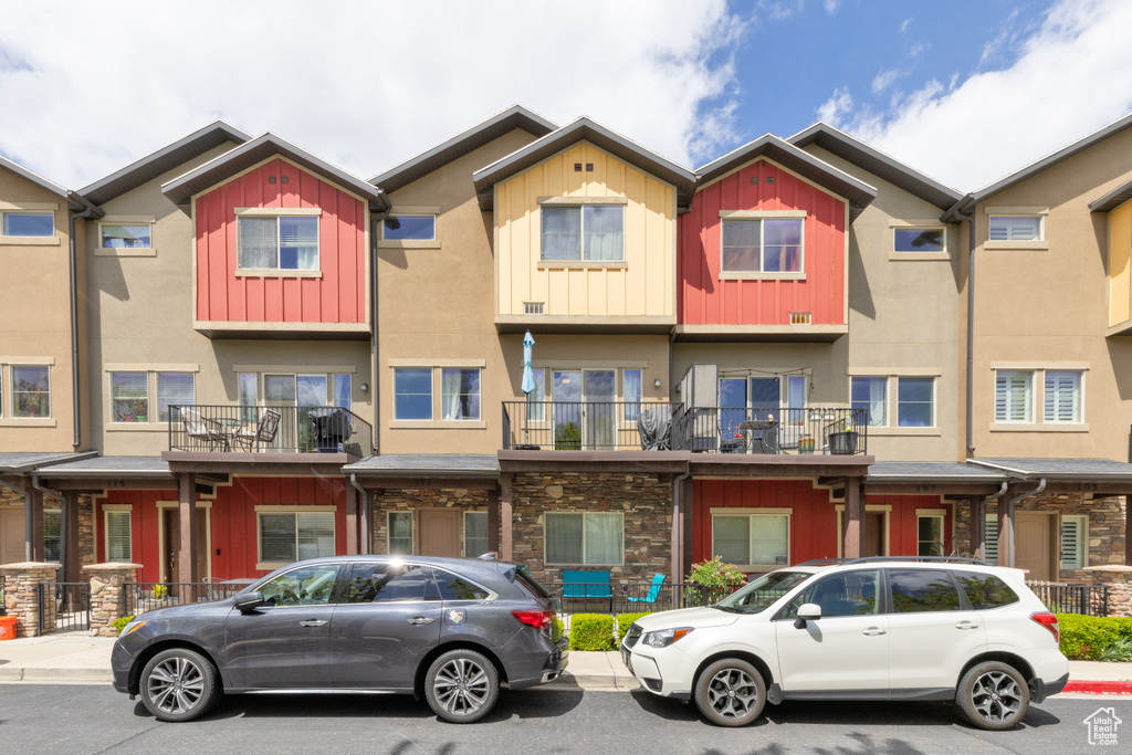 Multi unit property with board and batten siding, stucco siding, and stone siding