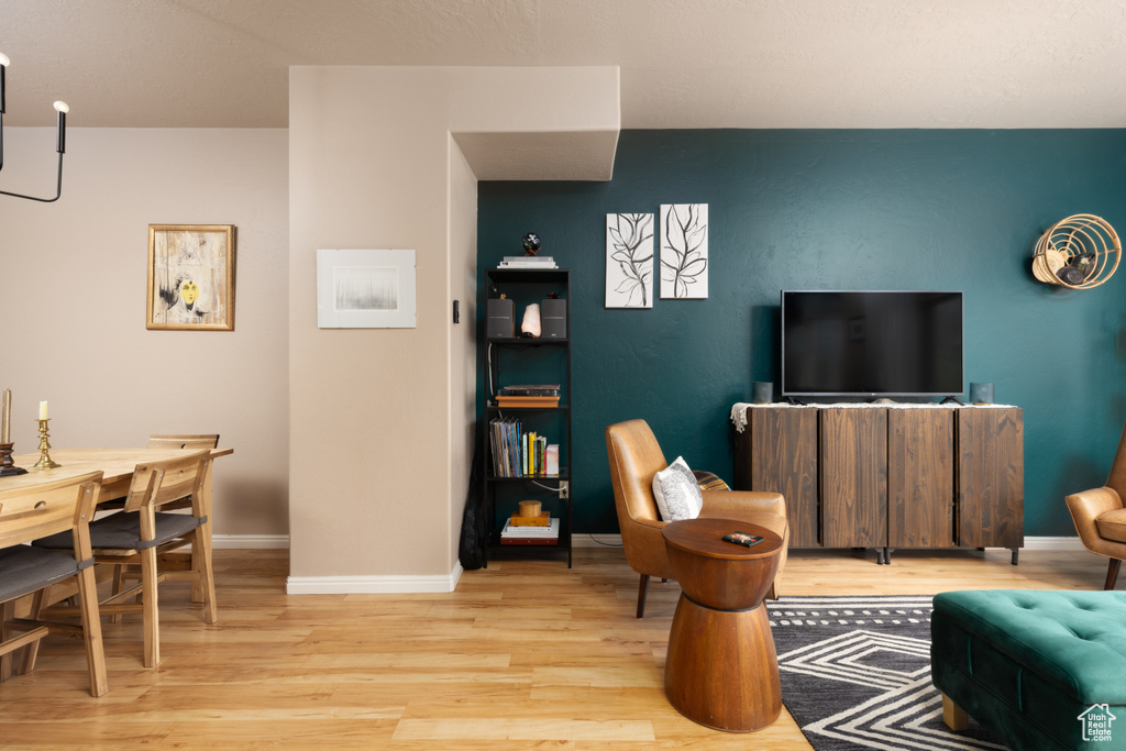 Living area featuring baseboards and wood finished floors