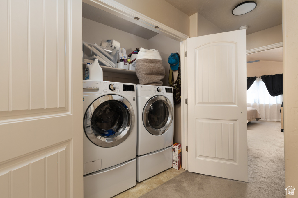 Laundry area with carpet, laundry area, and washer and dryer