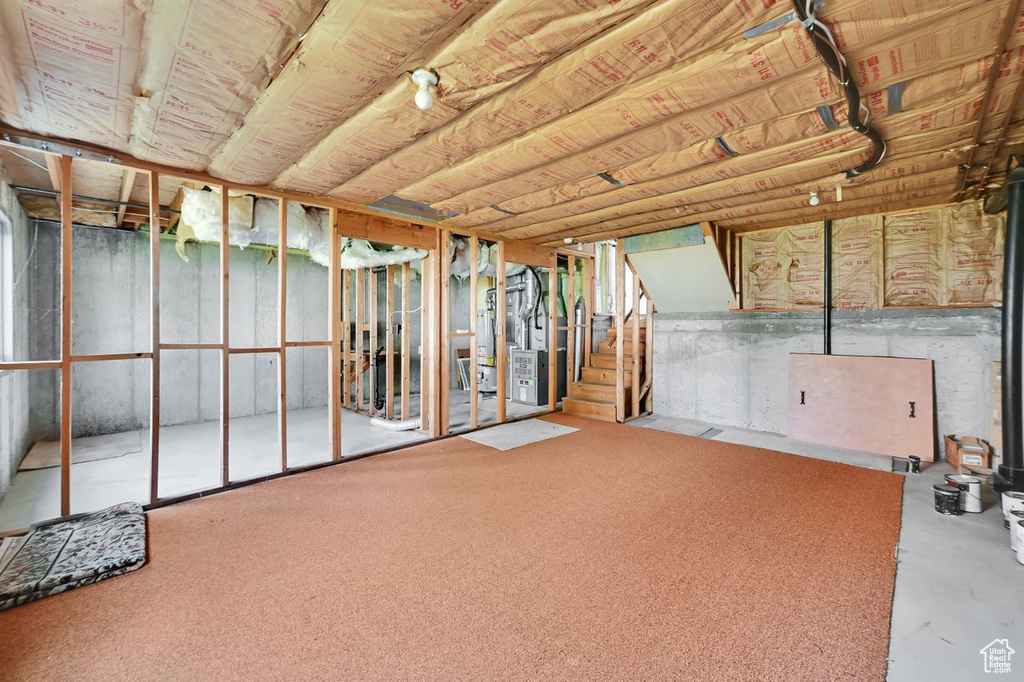 Unfinished below grade area with heating unit