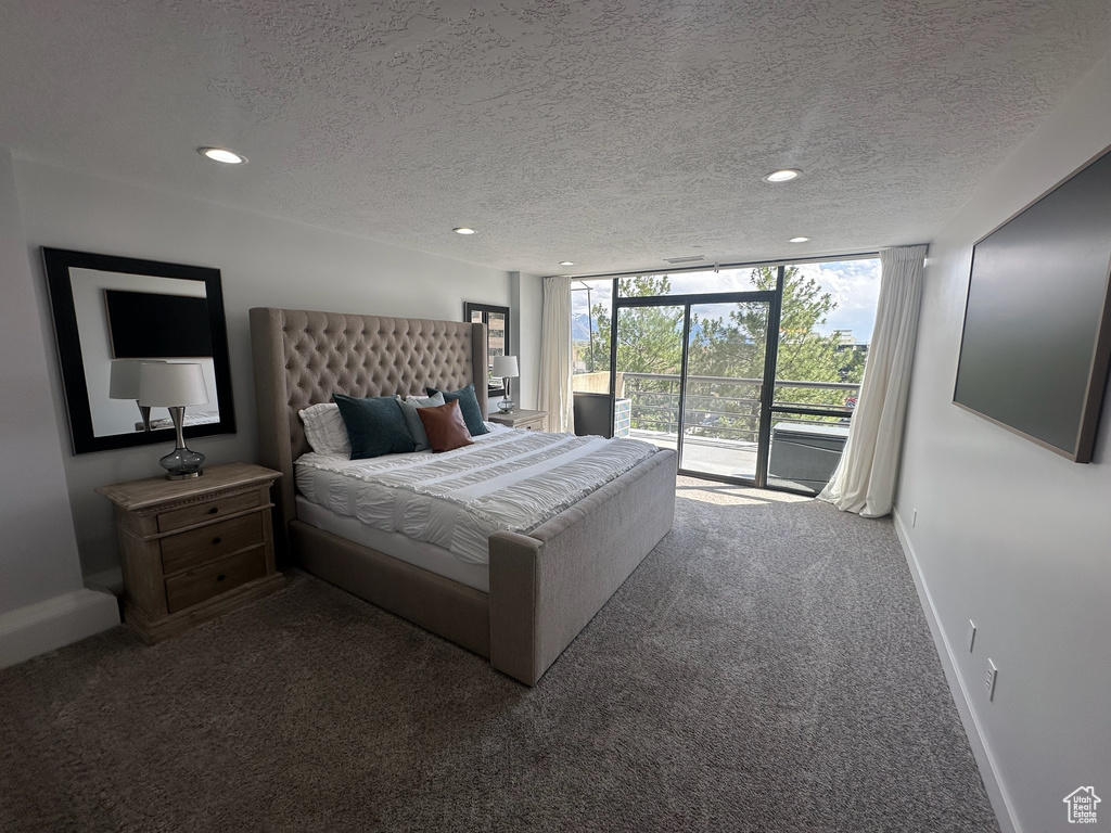 Bedroom featuring baseboards, carpet flooring, recessed lighting, and access to exterior