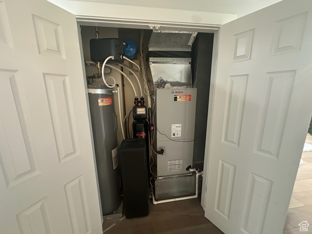 Utilities featuring water heater and heating unit