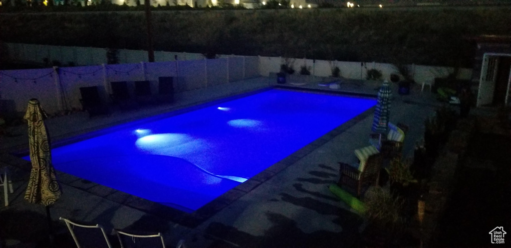 View of swimming pool featuring fence and a fenced in pool