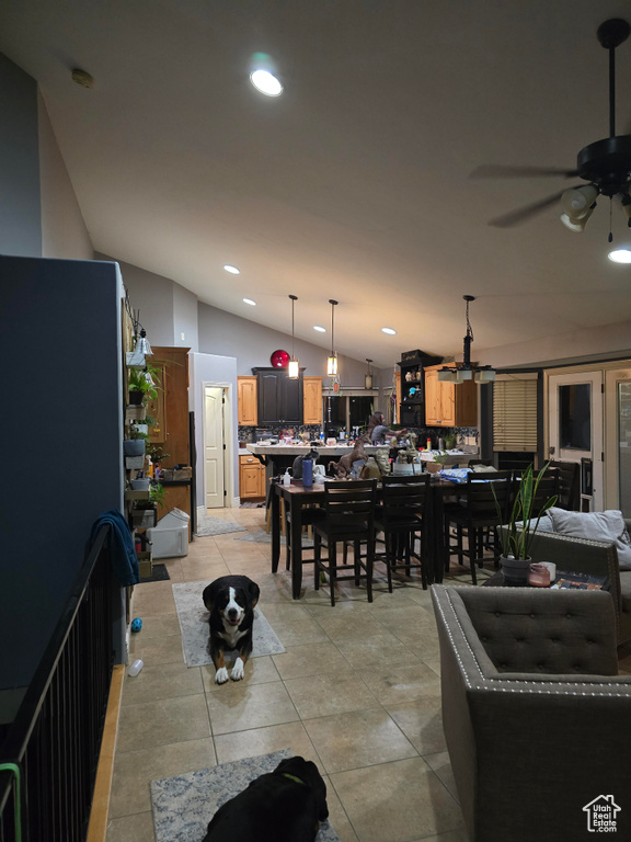 Dining space with recessed lighting, light tile patterned flooring, ceiling fan, and lofted ceiling