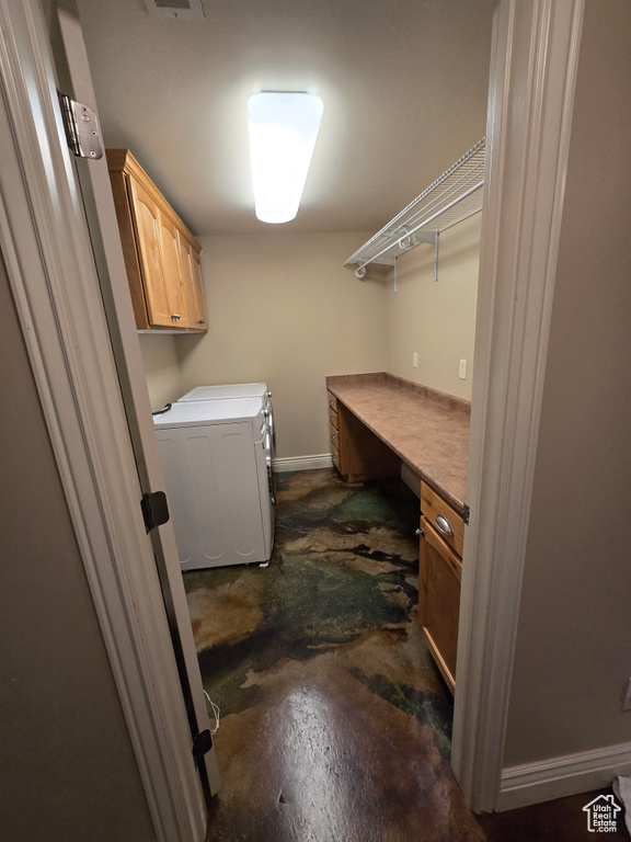 Laundry room featuring baseboards, visible vents, cabinet space, and separate washer and dryer