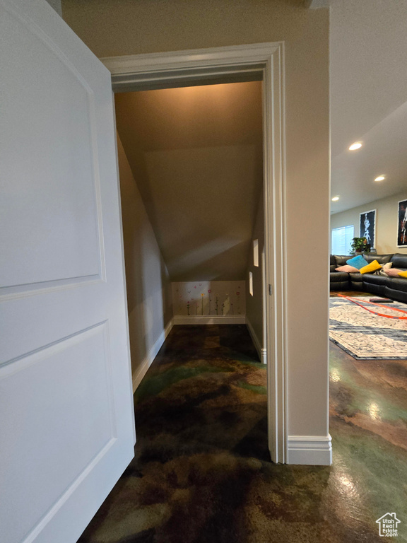 Interior space with baseboards, recessed lighting, and carpet floors